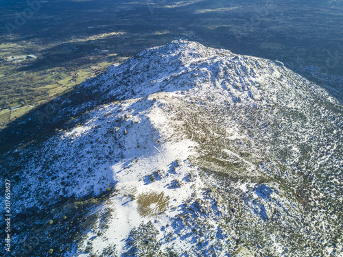 Wallpaper Mural And aerial view of the winter coming and covering with snow the slopes of the "Herreria" forest at El Escorial, Madrid, Spain Torontodigital.ca