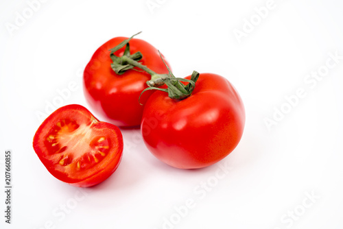 Red tomato isolated on white background with clipping path