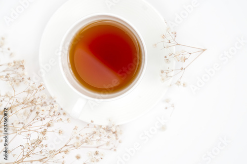Cup of tea with flowers isolated on white background