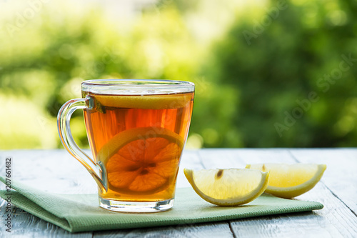 summer cold cup of tea on a wooden table photo