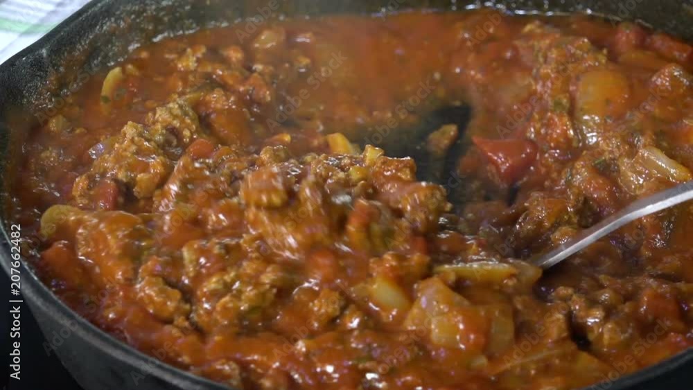 Stirring spaghetti sauce with meat, slow motion
Stirring spaghetti sauce with meat, slow motion