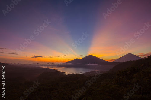 Scenic sunrise and mist at Agung volcano  Kintamani  Bali  Indonesia. Sunrise view of Agung volcano  nature landscape