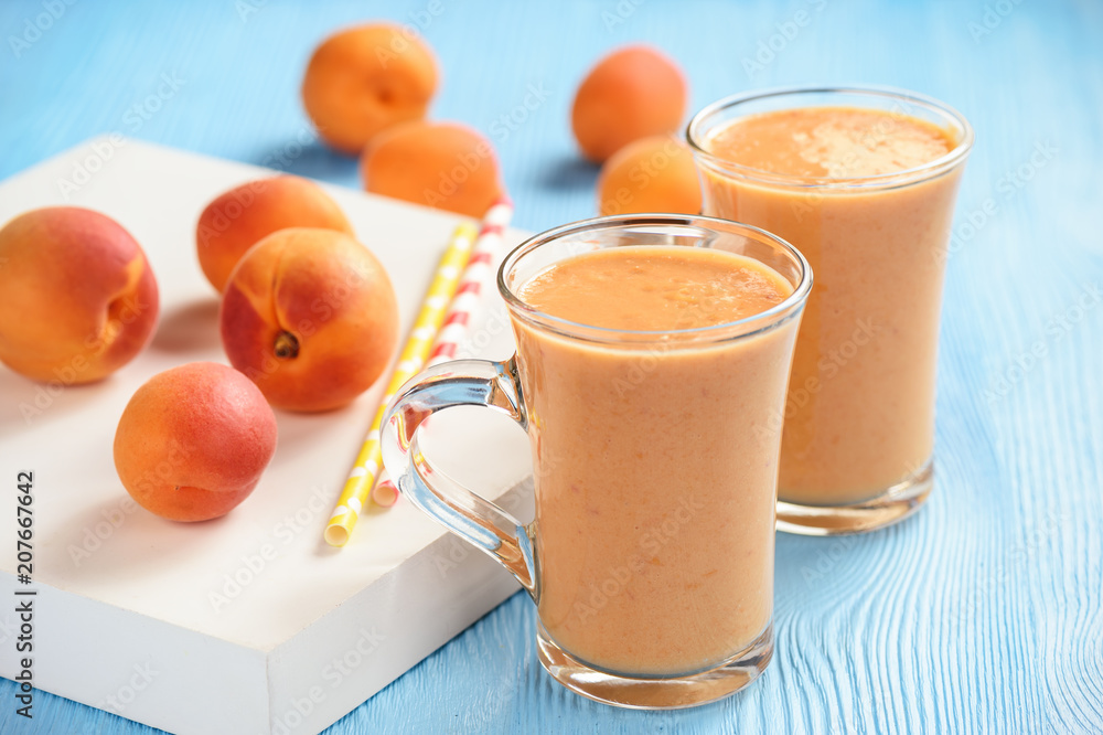 Apricot smoothie, healthy beverage, on wooden background. Apricot smoothie, healthy beverage, on wooden background.