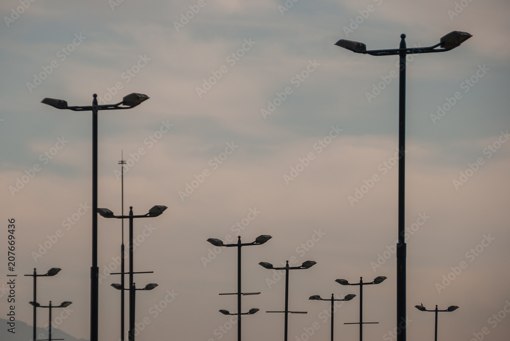 Many lampposts with the sky in the background Many lampposts with the sky in the background