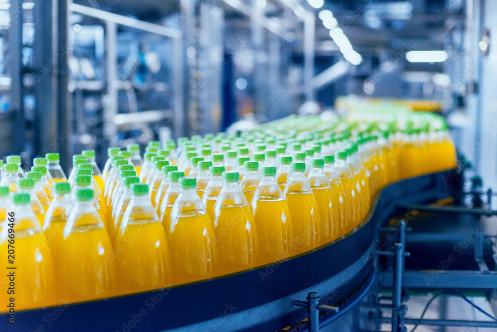 Conveyor with bottles for juice or water. Beverages factory equipments Conveyor with bottles for juice or water. Beverages factory equipments