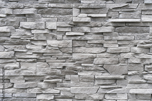 modern architectural detail representing gray decorative brick surface with irregular texture