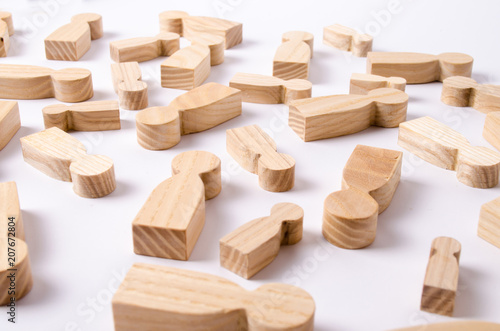 Wooden figures of people are lying on a white background. The concept of human resources management. Headhunters. Search for people to work. The search for the second half. Social network. Business