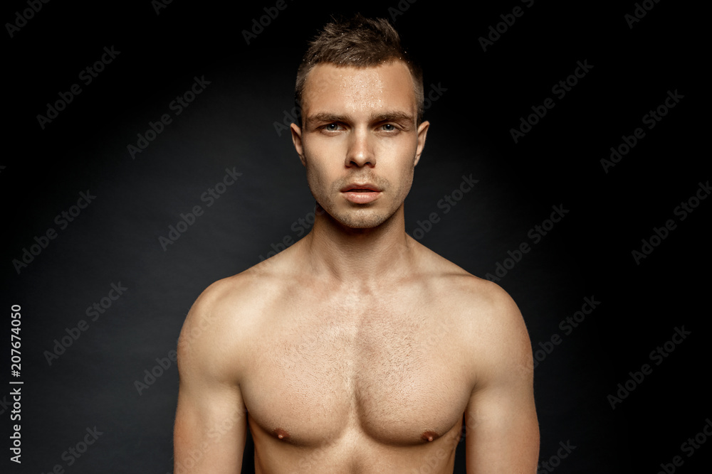 Sport guy portrait on black background Sport guy portrait on black background