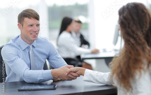 handshake Manager and the client in the office photo