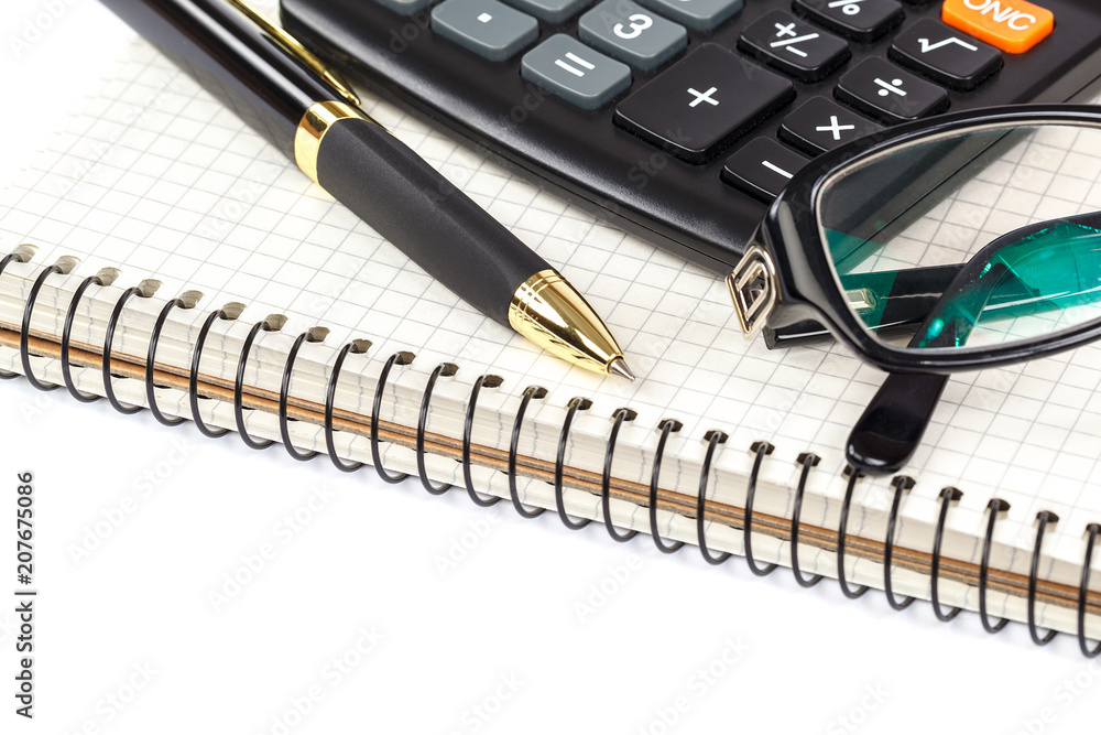 Pen, calculator and glasses on white background Pen, calculator and glasses on white background
