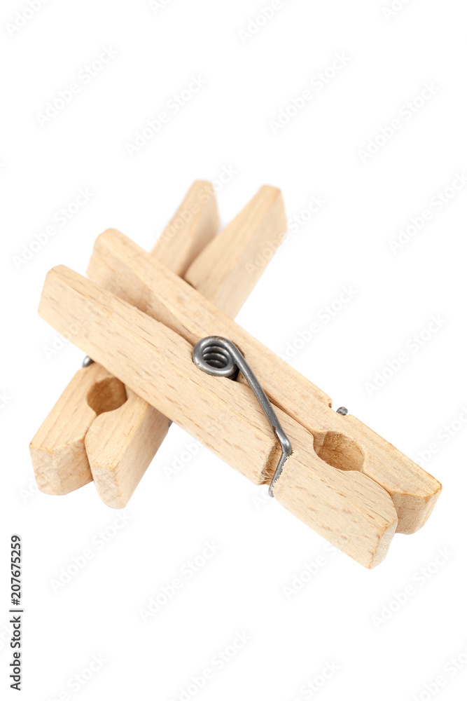 Wooden clothespins isolated on a white background.