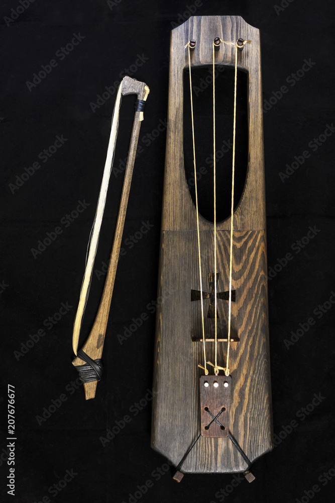 Wooden musical bowed harp instrument of talharpa Stock Photo | Adobe Stock