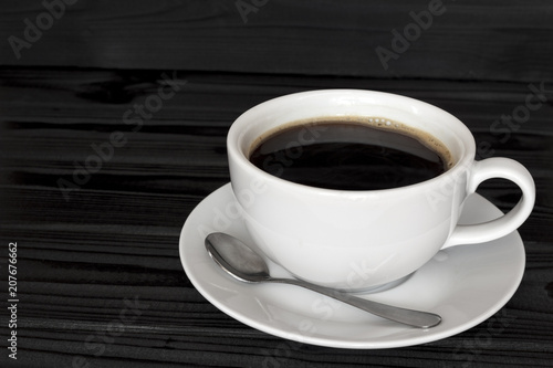 copy spaсe, cup of coffee on a dark wood background