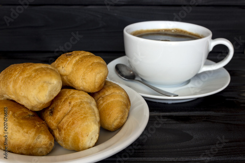 Croissants and a cup with a coffee