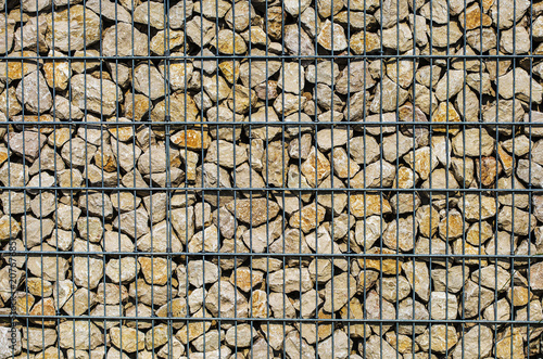 Detail of gabion wall filled with stones
 photo