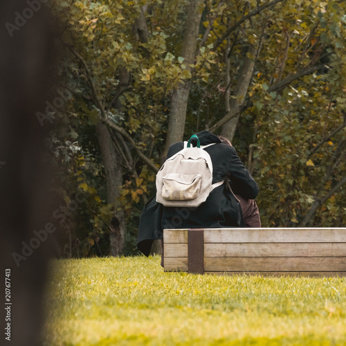 a man sitting on a bench