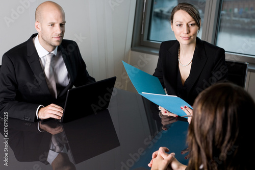 Job interview with two persons from a human resources team and a candidate