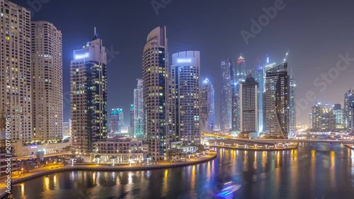 Wallpaper Mural Water canal on Dubai Marina skyline at night timelapse. Torontodigital.ca
