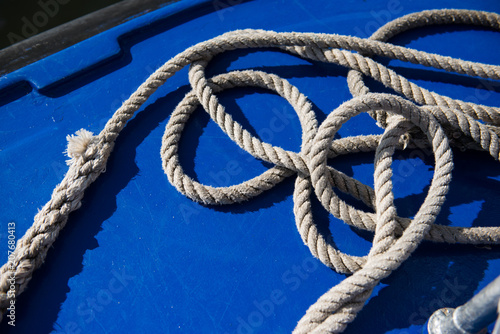 Rope on a blue boat. Yacht.