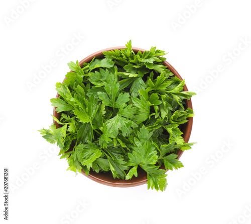 Bowl with fresh green parsley on white background, top view