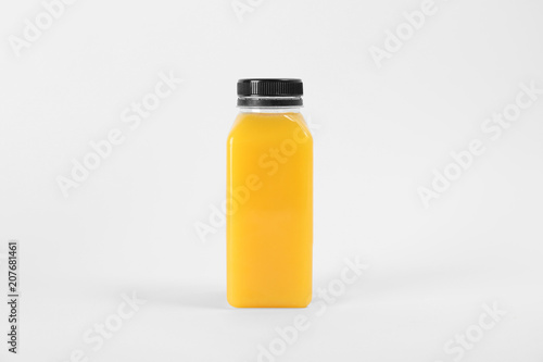 Bottle with delicious fresh juice on white background