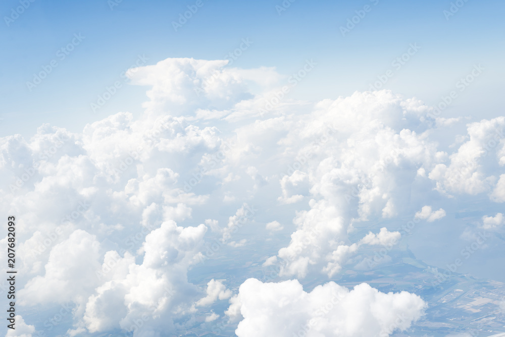 Skyline View above the Clouds from Airplane Skyline View above the Clouds from Airplane