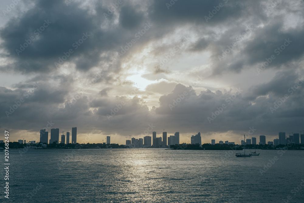 Pink sunset over miami downtown from the sea