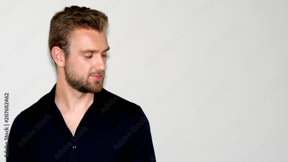 Handsome bearded boy looking down Handsome bearded boy looking down