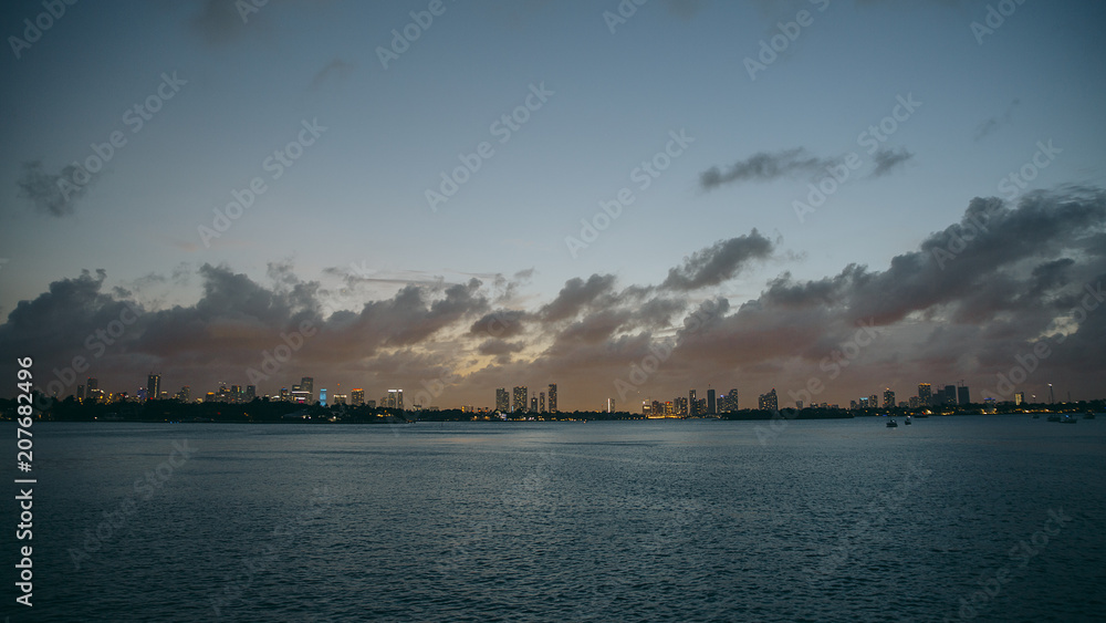 Pink sunset over miami downtown from the sea