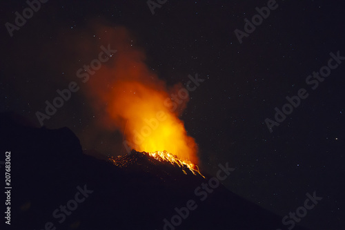 Stromboli volcano eruption during a starry night