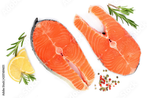Slice of red fish salmon with lemon, rosemary and peppercorns isolated on white background. Top view. Flat lay