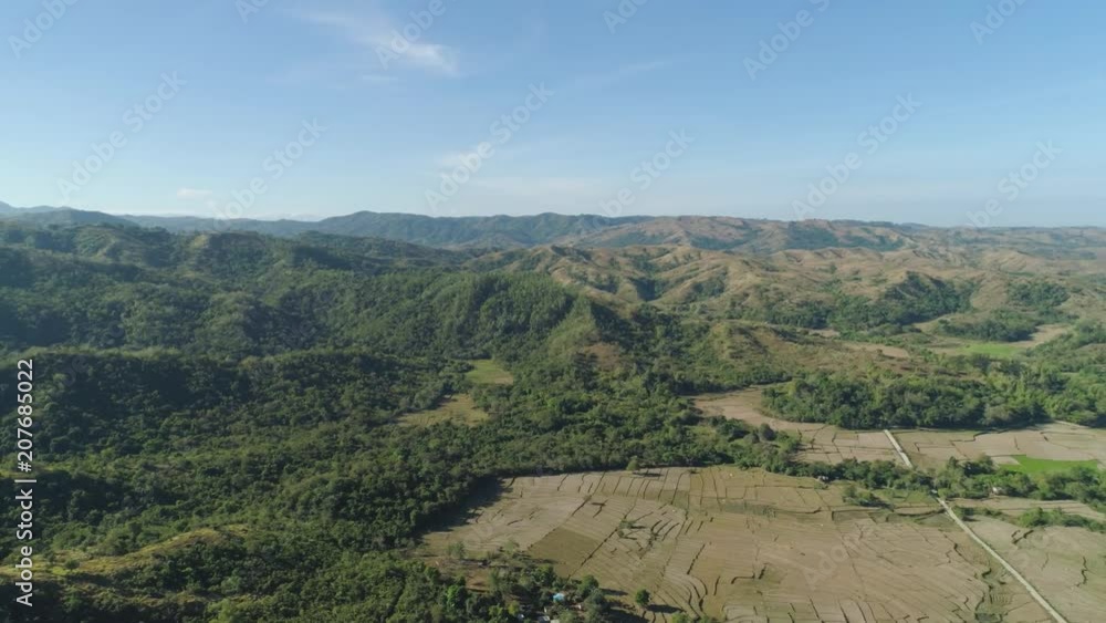 Mountain province with valley on the island of Luzon, Philippines. Aerial view of mountains covered forest, trees. Cordillera region. Mountain province with valley on the island of Luzon, Philippines. Aerial view of mountains covered forest, trees. Cordillera region.