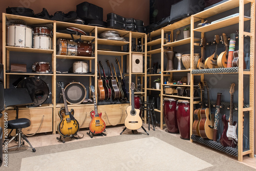 Musical instruments display on shelves in shop photo