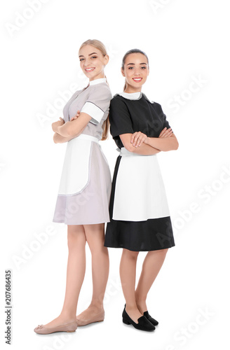 Full length portrait of young chambermaids on white background