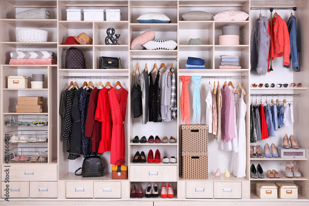 Large wardrobe with different clothes, home stuff and shoes - obrazy, fototapety, plakaty 