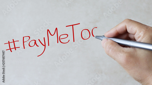 #PayMeToo text on paper background.