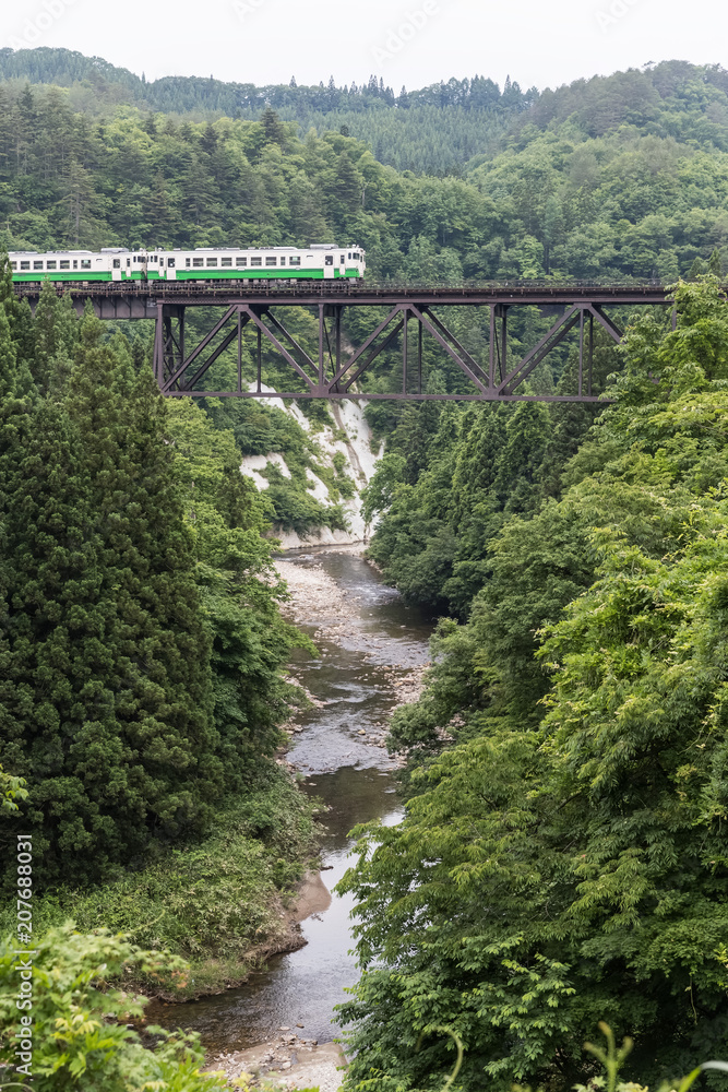 Tadami railway line and Tadami River in summer season at Fukushima prefecture. Tadami railway line and Tadami River in summer season at Fukushima prefecture.