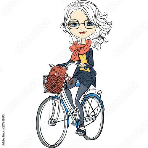 Cute beautiful fashionable girl riding a bike