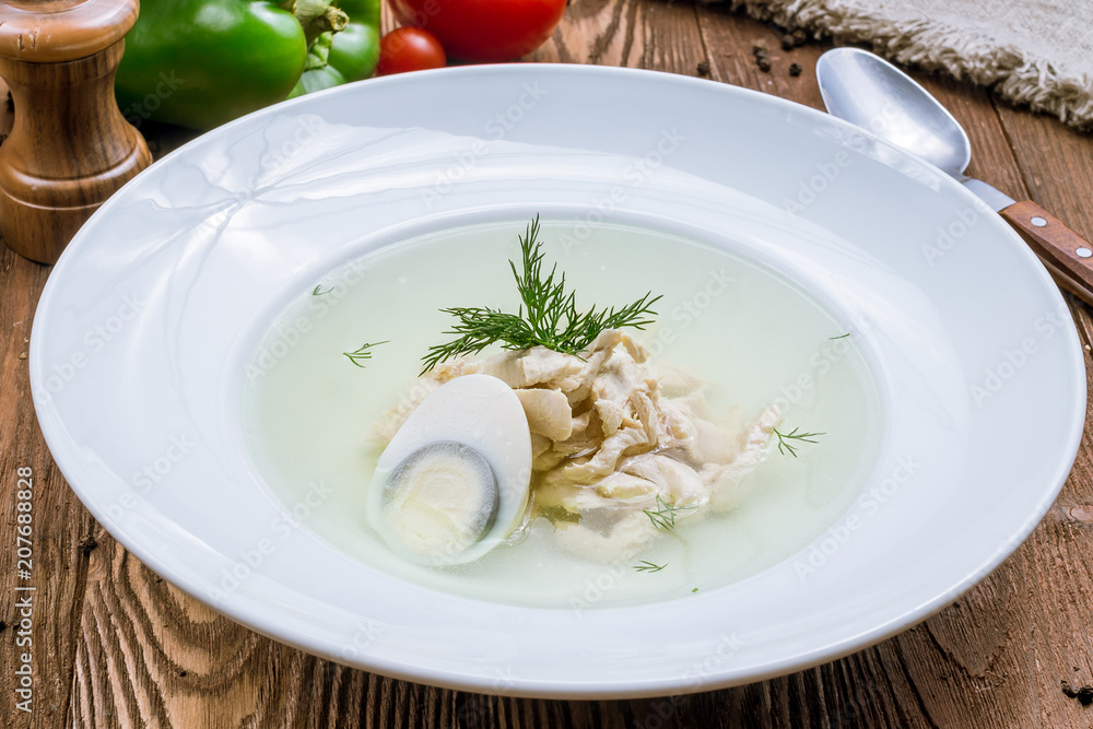 Chicken soup bouillon in a plate Chicken soup bouillon in a plate