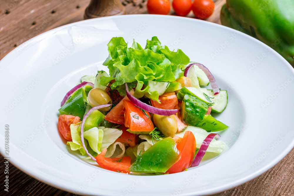 Vegetable salad with tomatoes and cucumbers Vegetable salad with tomatoes and cucumbers