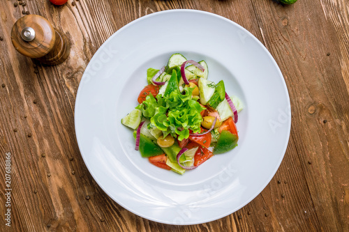 Vegetable salad with tomatoes and cucumbers