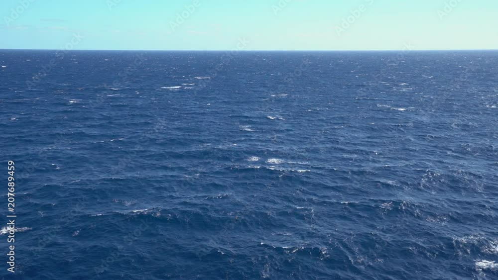 Aerial shot of open ocean. Flight over of open sea. Aerial shot of open ocean. Flight over of open sea.
