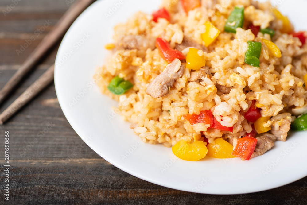 Fried rice with vegetables and pork, Asian cuisine Fried rice with vegetables and pork, Asian cuisine