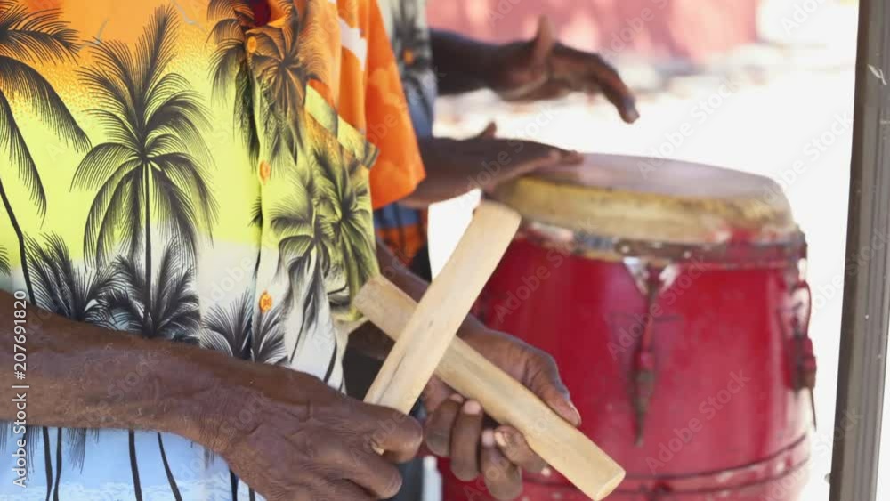 Traditionally dressed caribbean musicians, band. Native musicians - March 2018: Labadee, Haiti