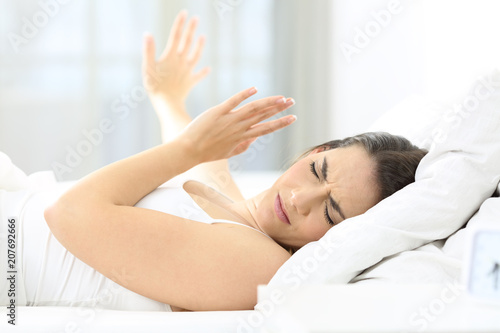 Girl upset waking up with the light bothering her photo
