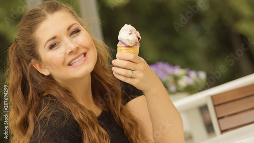 Young woman eating ice cream