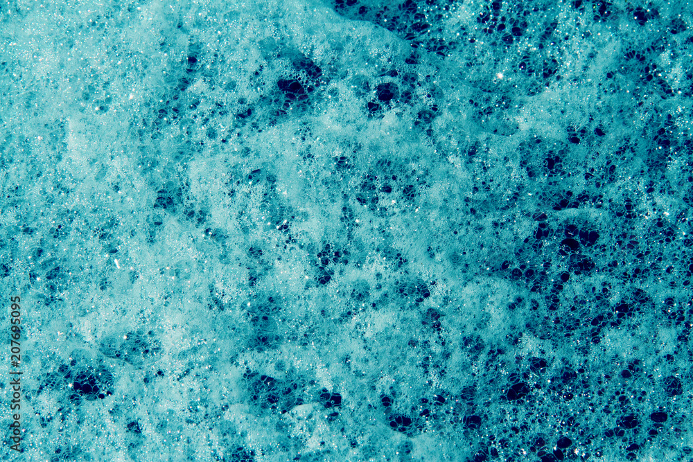 Close up of a lot of blue suds on water. - obrazy, fototapety, plakaty 