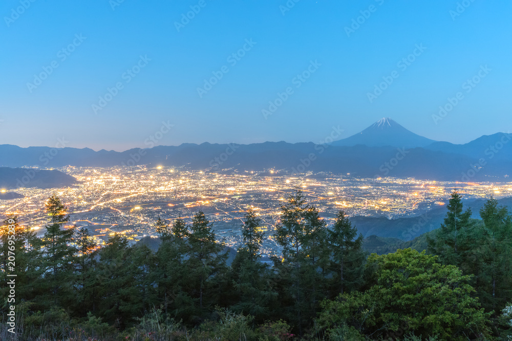 Mt.Fuji and Kofu city with sunrise sky seen from Mt. Amariyama view point.