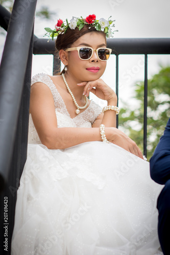 Принти на полотні Beautiful Young woman sitting on balcony.