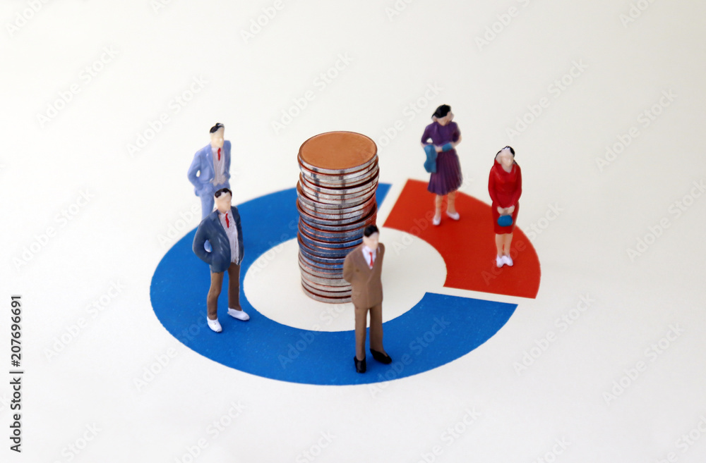 Miniature men and women standing on a donut graph. A concept of discrimination against men and women in the enterprise when hiring employees. Miniature men and women standing on a donut graph. A concept of discrimination against men and women in the enterprise when hiring employees.